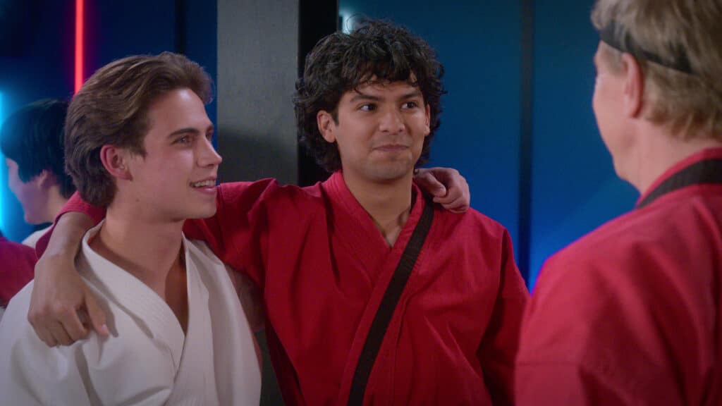 Cobra Kai. (L to R) Tanner Buchanan as Robby Keene, Xolo Maridueña as Miguel Diaz, William Zabka as Johnny Lawrence in episode 508 of Cobra Kai. Cr. Courtesy of Netflix © 2022