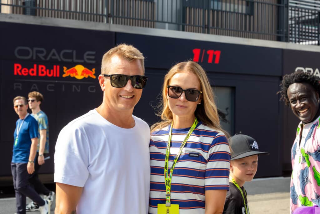 Kimi Räikkönen and wife posing for The Hollywood Reporter Japan. In the background (right) Kimi's son Robin.