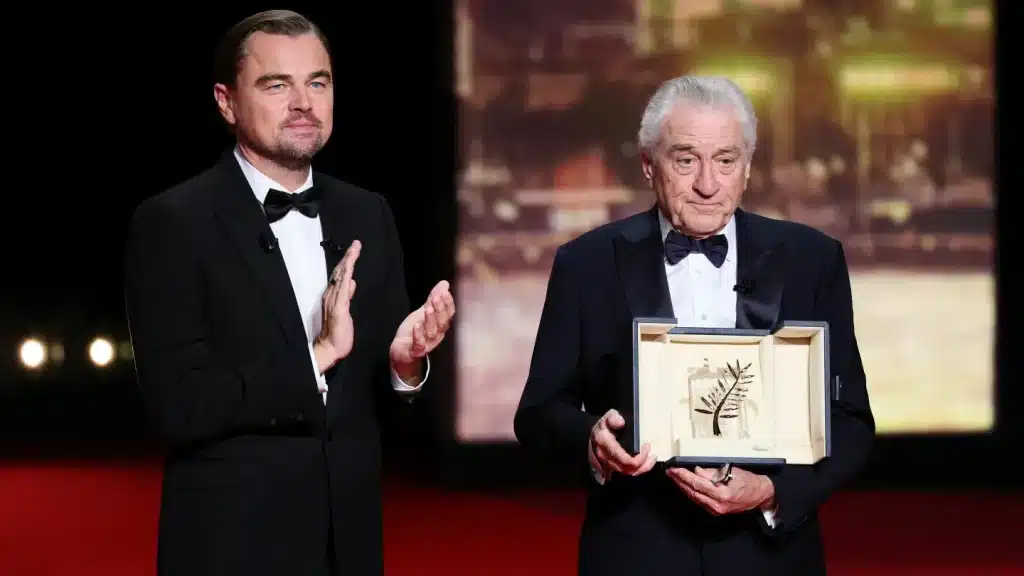 Robert De Niro accepts the honorary Palme d'Or from Leonardo DiCaprio during the opening ceremony at the 78th Cannes Film Festival at the Palais de Festival on May 13, 2025. (Photo by Andreas Rentz/Getty Images)