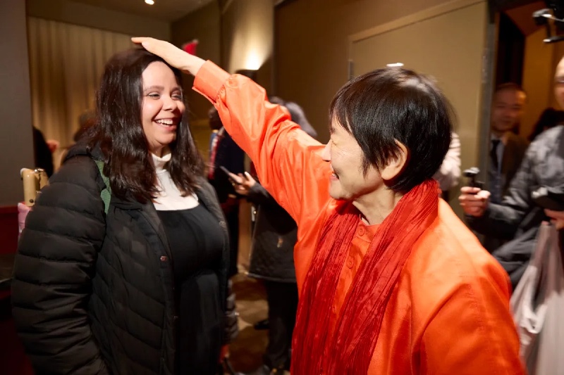 Yogmata Keiko Aikawa giving a blessing to Samantha Fuentes